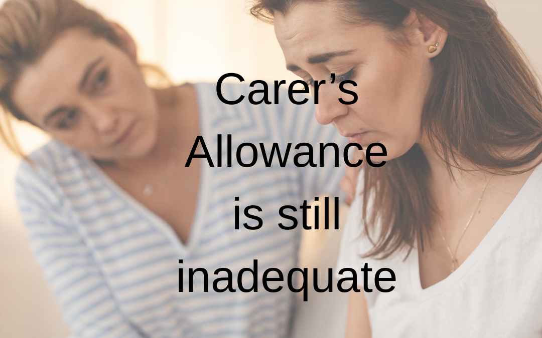 A photo of a lady and her carer and the wordig "carer's allowance is still inadequeate"